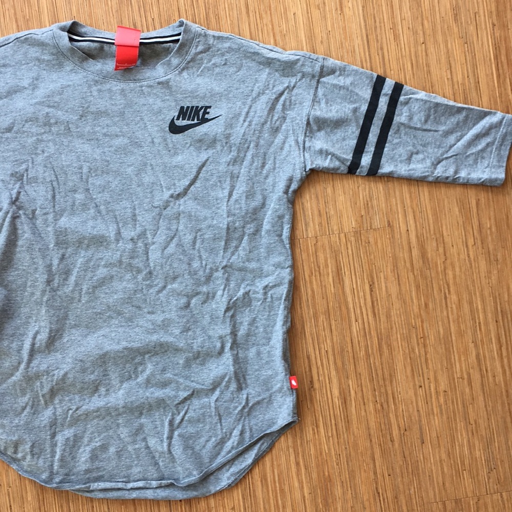 Nike grey 3/4 length sleeved shirt.